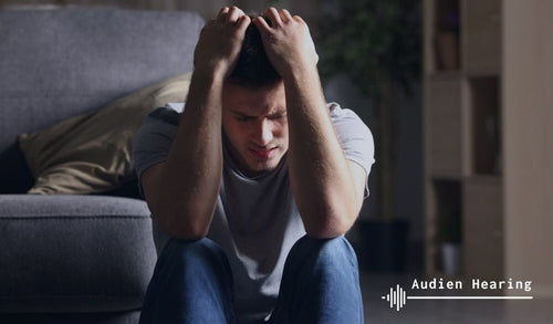 Individual experiencing ringing in the ears from a pinched nerve